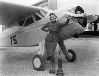 Pilot Betty Browning with a Cessna C-34 and the Amelia Earhart trophy she won for the Closed Course Race for Women Pilots at the National Air Races in Los Angeles, September 10, 1936. Courtesy Kansas Aviation Museum