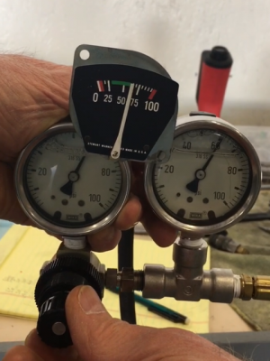 Checking calibration of oil pressure gauge with differential pressure gauges